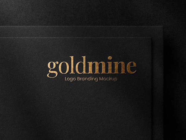 Luxury gold foil embossed logo mockup on black paper