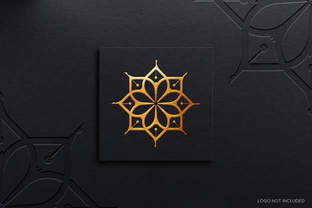 PSD luxury gold foil logo mockup design with black glossy paper texture background