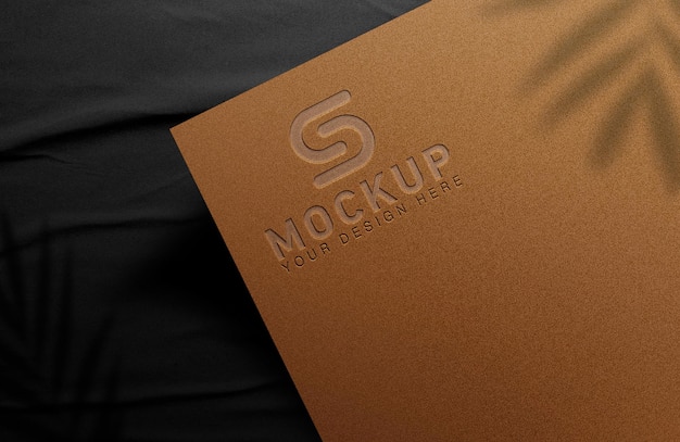 Luxury logo mockup 3d on gold gradient colors paper mockup on black cloth