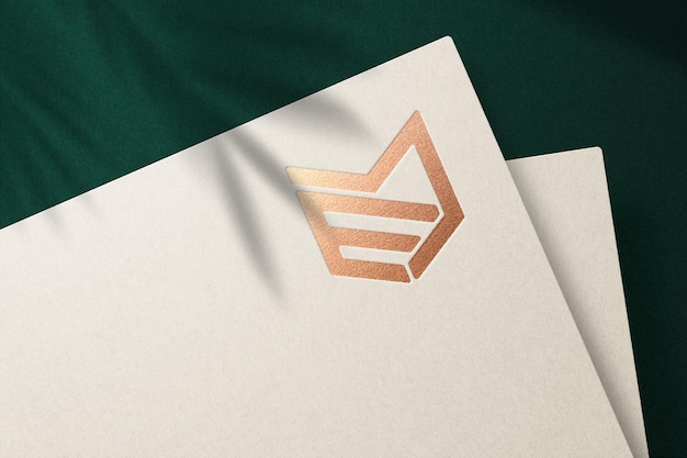 Luxury logo mockup with debossed effect on cream paper premium psd