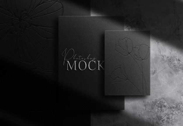 PSD luxury silver embossed paper top view mockup