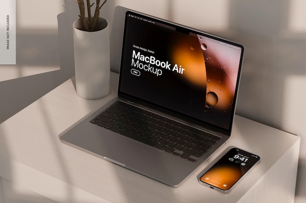 Macbook air and iphone pro with sunset light mockup