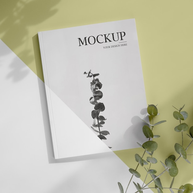 Magazine en bladeren mockup bovenaanzicht