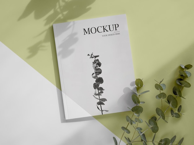 Magazine and leaves mockup