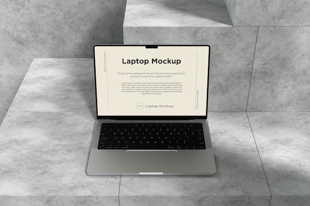 Makieta laptopa na tle cementu