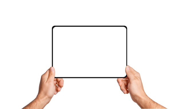 Male hands holding tablet with blank screen on empty background