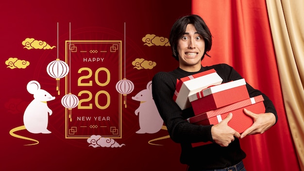 Male holding gift boxes for new year