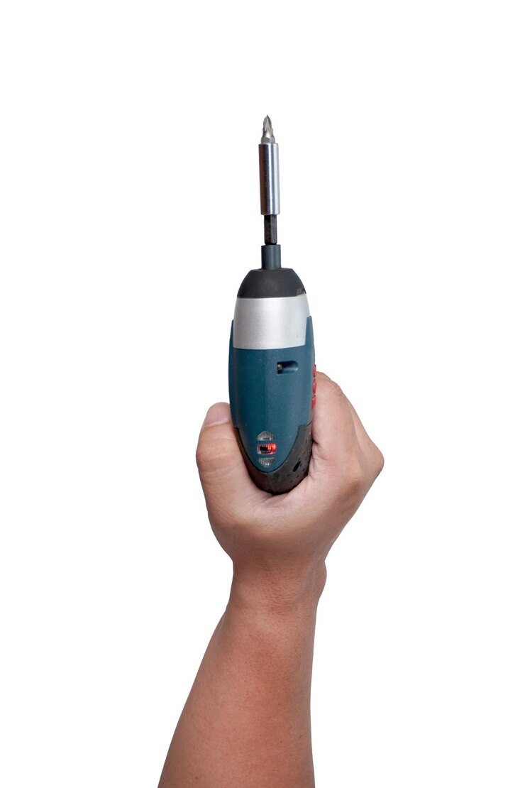 PSD male person hand holding electric power screwdriver cut out isolated