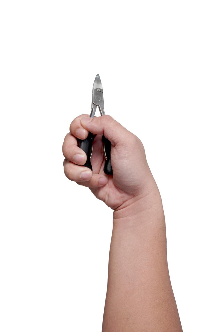 PSD male person hand holding pliers cut out isolated