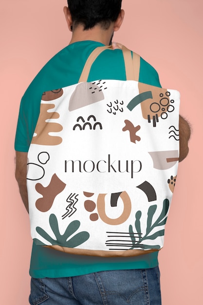 Man carrying tote bag mockup