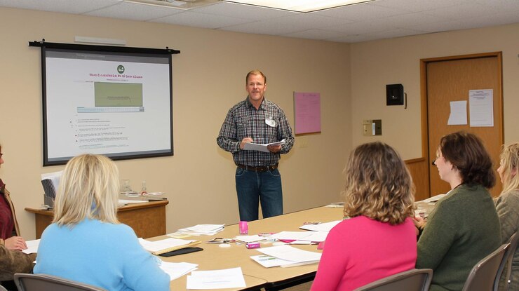 PSD man giving presentation to small group in conference room