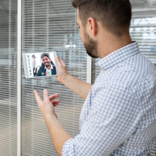 PSD man having a video conference at work