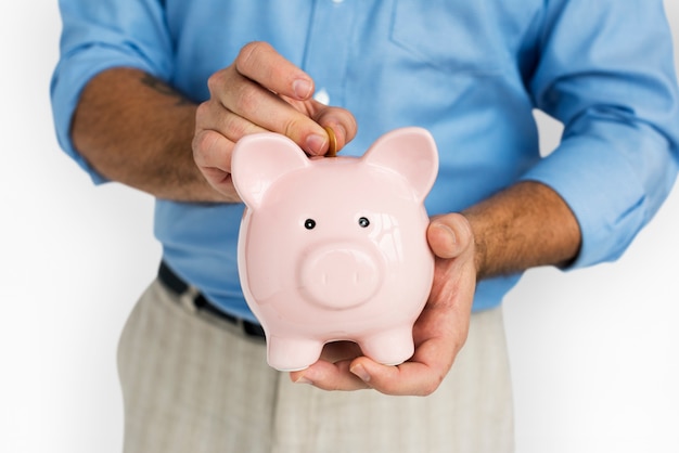 PSD man holding piggy bank saving portrait concept