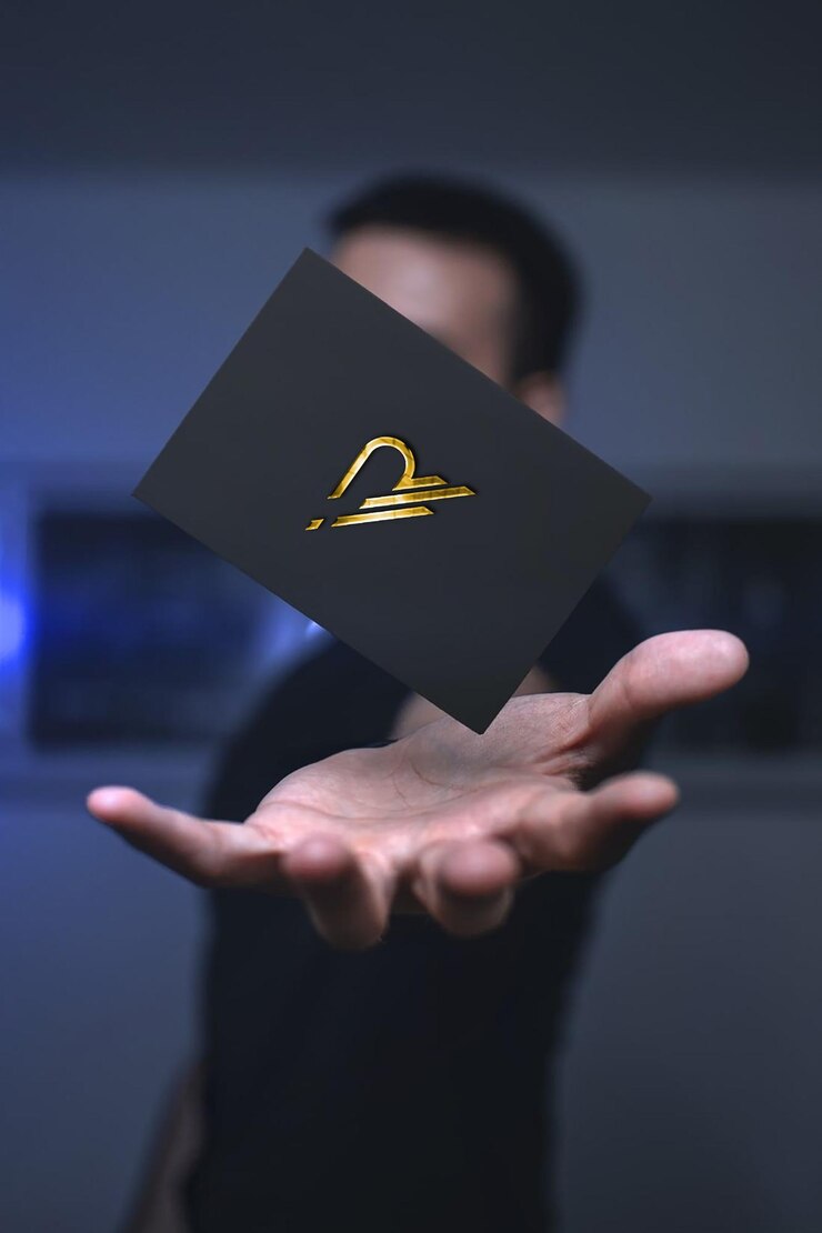 PSD a man holds a black square with a gold sign that says " zodiac " on it.