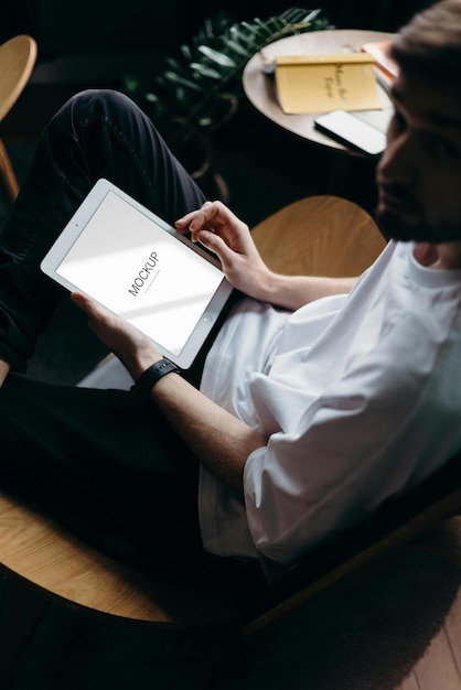 a man is holding a book with the word  the  on it