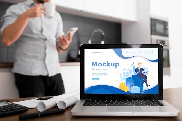 Man in kitchen with laptop mock-up