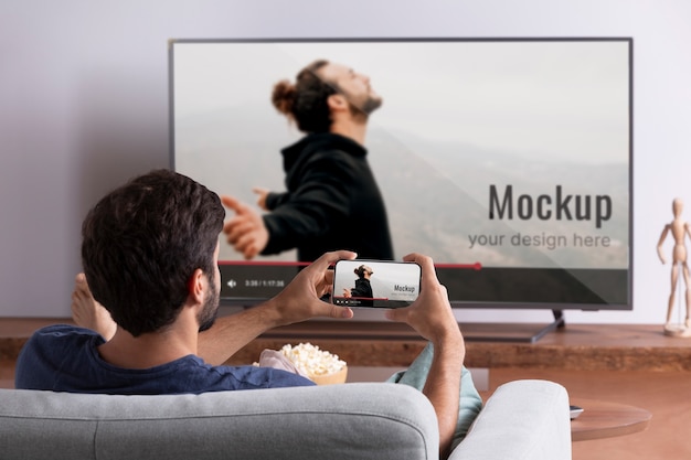 man playing on screen mockup