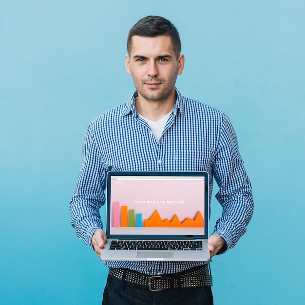 Man presenting laptop mockup