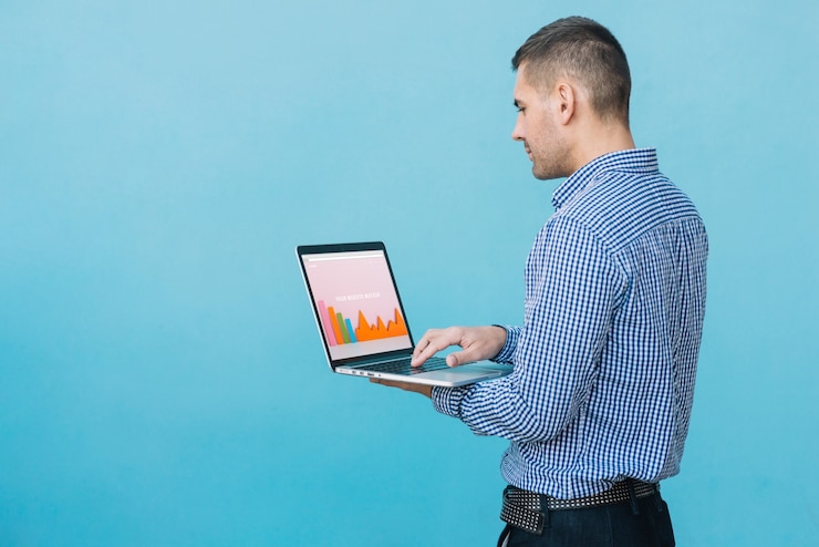 PSD man presenting laptop mockup