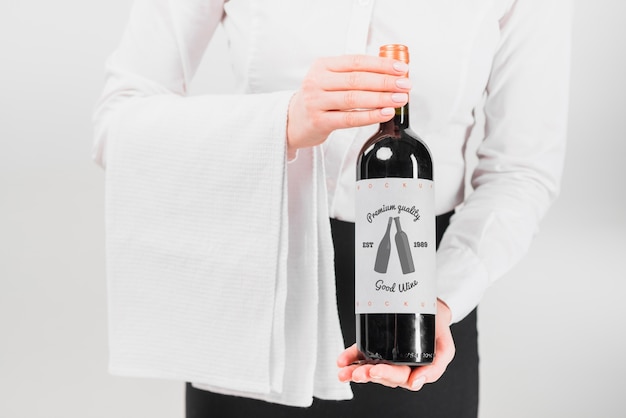 Man presenting wine bottle