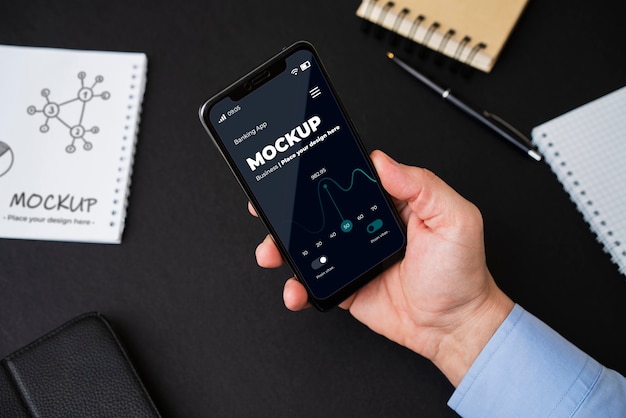 man's hand holding phone mock-up