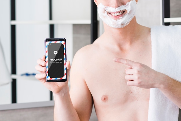 Man shaving mobile phone barber app