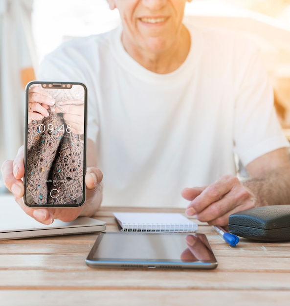 Man showing smartphone mockup