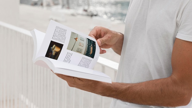 PSD man on street reading book