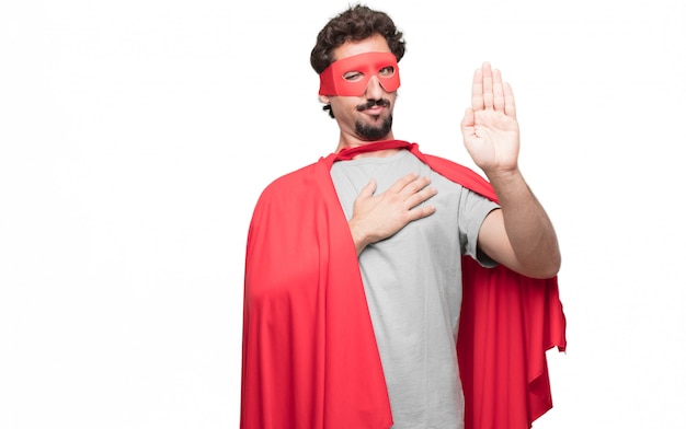 Man in superhero dress in satisfied pose