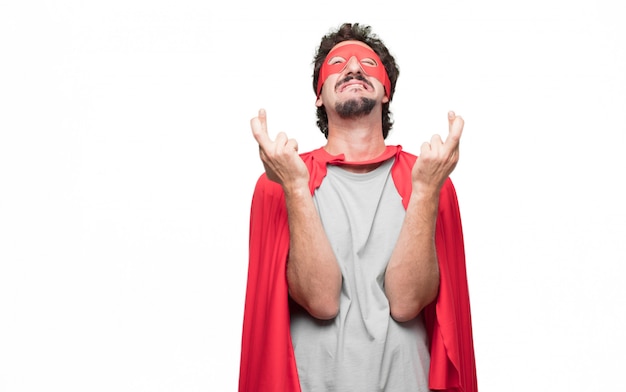 man in superhero dress wishing something