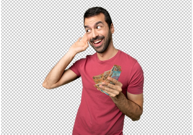 PSD man taking a lot of money listening to something by putting hand on the ear