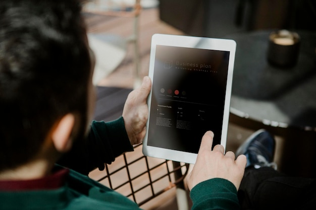 PSD man using a digital tablet screen mockup