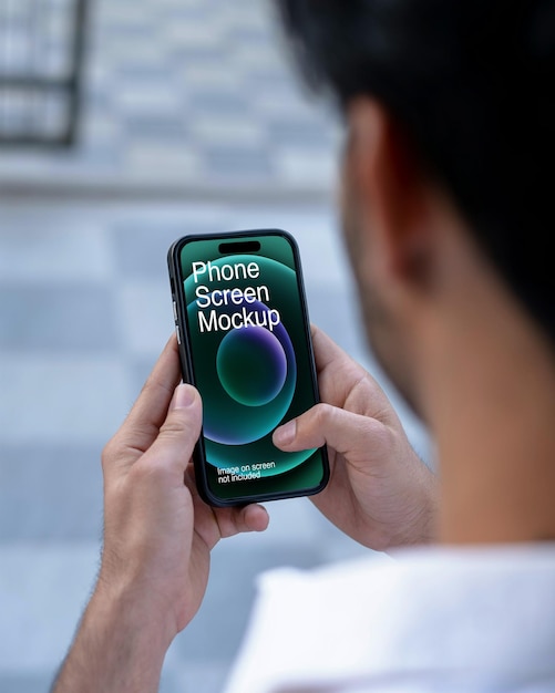 A man using smartphone with screen mockup