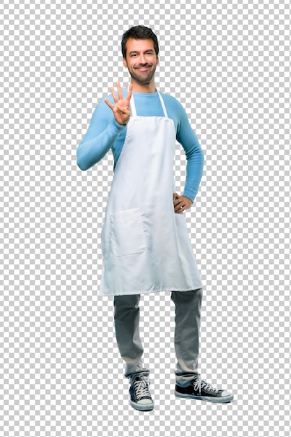 Man wearing an apron happy and counting four with fingers