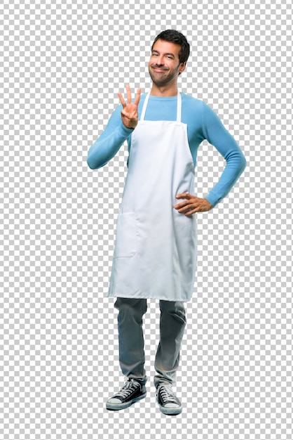 Man wearing an apron happy and counting three with fingers