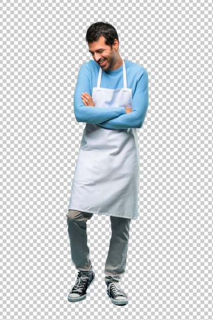PSD man wearing an apron keeping the arms crossed while smiling