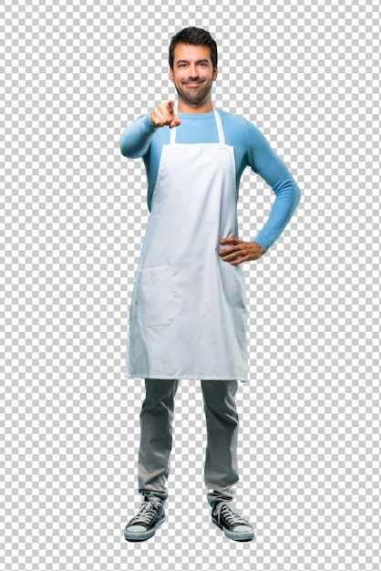 PSD man wearing an apron points finger at you with a confident expression