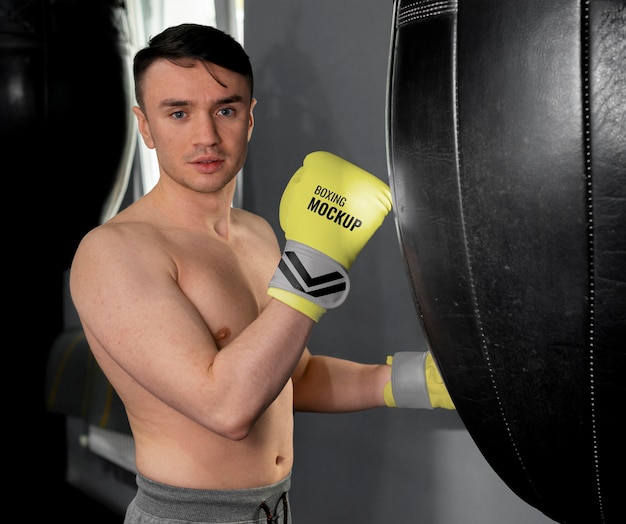 Man wearing boxing gloves mock-up