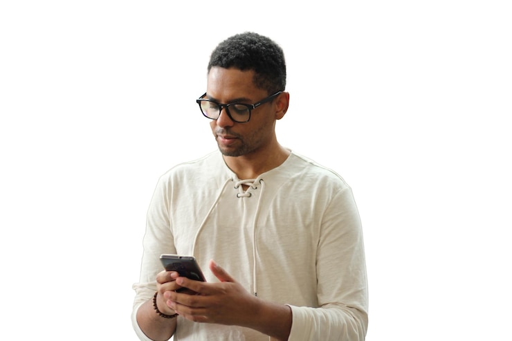PSD a man wearing glasses looking at his phone