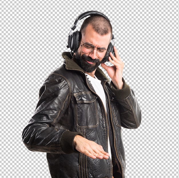 Man wearing a leather jacket listening music