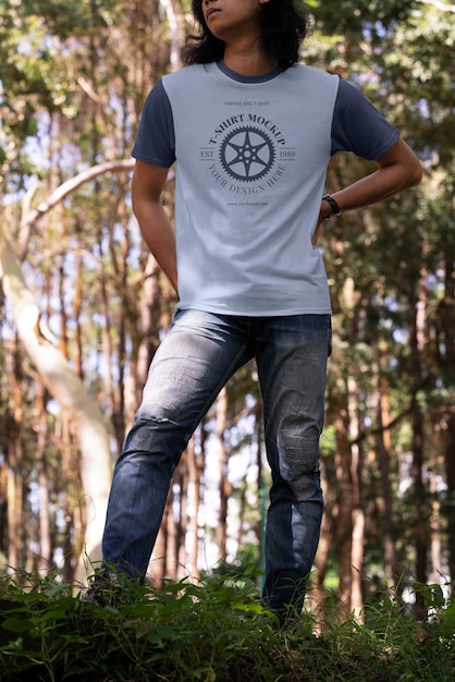 PSD man wearing shirt mock-up outdoors in nature