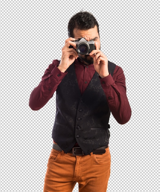 Man wearing waistcoat photographing 