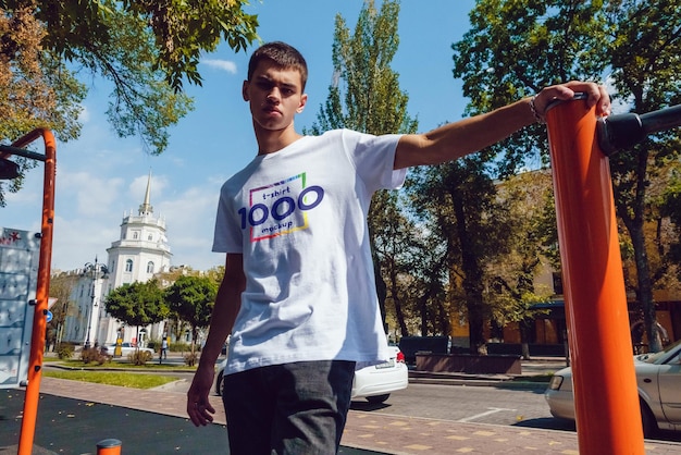 man in a white shirt at an outdoor workout