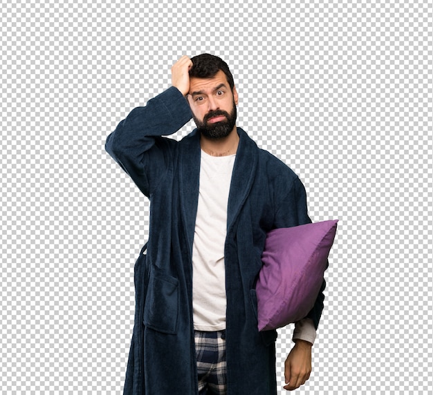 PSD man with beard in pajamas with an expression of frustration and not understanding