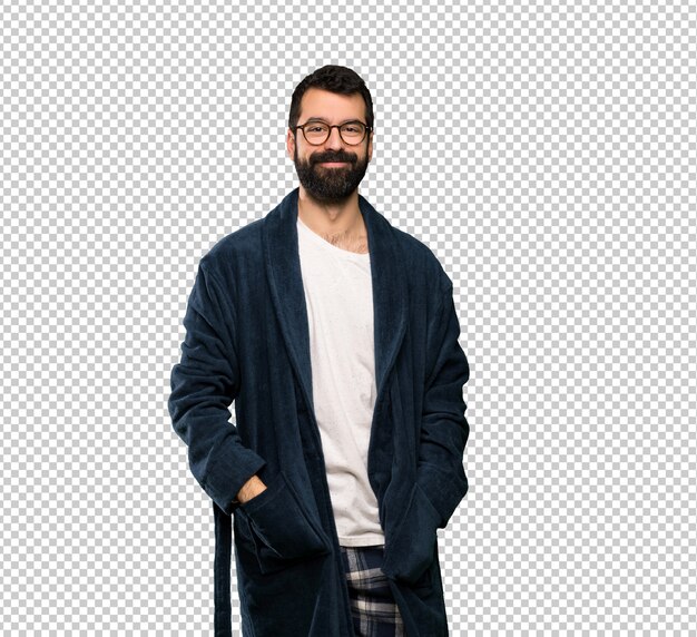 Man with beard in pajamas with glasses and happy