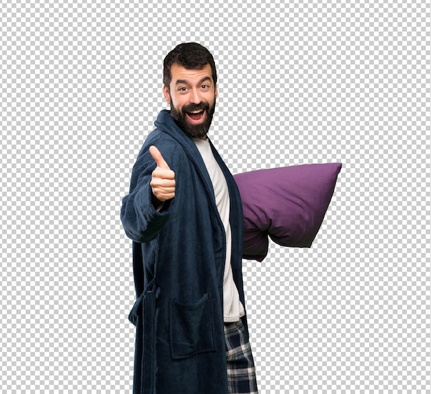 Man with beard in pajamas with thumbs up because something good has happened