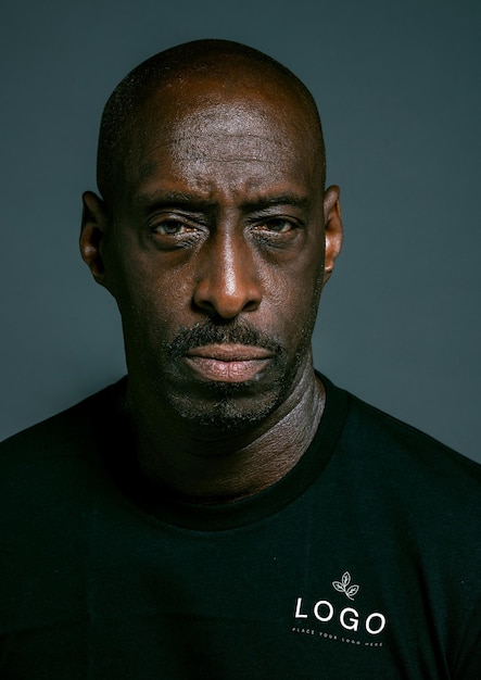 a man with a black shirt that says bald on it