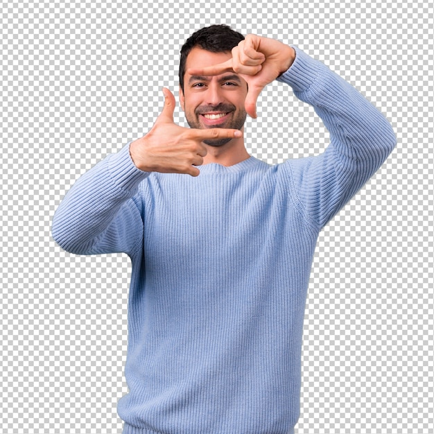 Man with blue sweater focusing face. framing symbol