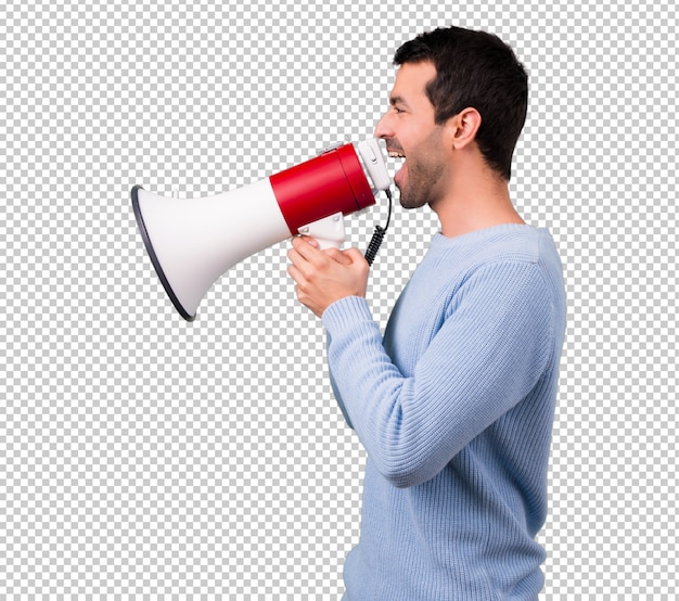 Man with blue sweater shouting through a megaphone