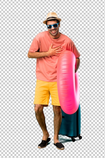 PSD man with hat and sunglasses on his summer vacation smiling a lot while putting hands on chest